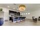Modern kitchen with dark cabinetry, breakfast bar and stainless steel appliances at 5453 Del Coronado Dr, Apollo Beach, FL 33572