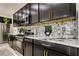 Modern kitchen with stainless steel appliances and mosaic backsplash at 5453 Del Coronado Dr, Apollo Beach, FL 33572
