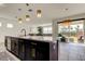 Open concept kitchen with large island and marble countertops at 5453 Del Coronado Dr, Apollo Beach, FL 33572