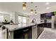 Stylish kitchen with dark cabinetry and marble countertops at 5453 Del Coronado Dr, Apollo Beach, FL 33572