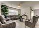 Relaxing living room featuring sectional sofa and accent chairs at 5453 Del Coronado Dr, Apollo Beach, FL 33572