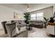 Spacious living room featuring a sectional sofa, stylish coffee table, and large windows at 5453 Del Coronado Dr, Apollo Beach, FL 33572