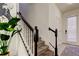 Modern staircase with black railing and gray carpeting at 5453 Del Coronado Dr, Apollo Beach, FL 33572