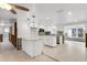 Bright kitchen with white cabinetry, stainless steel appliances, and mosaic tile backsplash at 5600 Bayou Grande Ne Blvd, St Petersburg, FL 33703