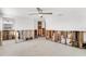 A partially-renovated room that includes a view of a partially renovated bathroom; the walls expose studs and pipes at 5600 Bayou Grande Ne Blvd, St Petersburg, FL 33703