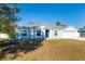 One story home with gray siding and blue door at 6516 Clair Shore Dr, Apollo Beach, FL 33572