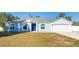 Charming one-story home with blue door and attached garage at 6516 Clair Shore Dr, Apollo Beach, FL 33572