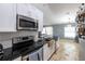 Updated kitchen featuring stainless steel appliances and white cabinets at 6516 Clair Shore Dr, Apollo Beach, FL 33572