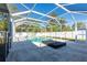 Pool area with covered patio and lounge at 6516 Clair Shore Dr, Apollo Beach, FL 33572