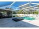 Relaxing pool area with covered patio and lounge at 6516 Clair Shore Dr, Apollo Beach, FL 33572