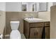 Clean bathroom with beige tile and a vanity with granite countertop at 6623 16Th N St, St Petersburg, FL 33704