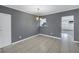 Simple dining area with gray walls and tiled floor at 6623 16Th N St, St Petersburg, FL 33704