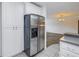 Stainless steel refrigerator in a white kitchen at 6623 16Th N St, St Petersburg, FL 33704