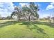 Home situated on a large lot with mature trees and open space at 6819 Stafford Rd, Plant City, FL 33565