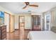 Bright bedroom with wood floors and ceiling fan at 6819 Stafford Rd, Plant City, FL 33565