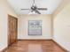 Simple bedroom with wood floors and ceiling fan at 6819 Stafford Rd, Plant City, FL 33565