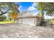 Three-car garage with ample space and a concrete driveway at 6819 Stafford Rd, Plant City, FL 33565