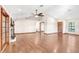 Living room with hardwood floors, fireplace and access to other rooms at 6819 Stafford Rd, Plant City, FL 33565