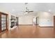 Open living room featuring hardwood floors and a fireplace at 6819 Stafford Rd, Plant City, FL 33565