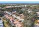 Aerial view of a residential neighborhood showcasing a townhome community with solar panels at 7262 55Th N Ave, St Petersburg, FL 33709