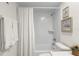 Simple bathroom with a shower/tub combo and white tile at 7262 55Th N Ave, St Petersburg, FL 33709