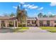 Condo exterior with landscaped yard and brick paver driveway at 7262 55Th N Ave, St Petersburg, FL 33709