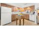 Bright kitchen features wood cabinets, modern flooring, and a butcher block island at 7262 55Th N Ave, St Petersburg, FL 33709