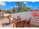 Relaxing patio with wooden furniture and bright bougainvillea at 7262 55Th N Ave, St Petersburg, FL 33709