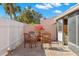 Relaxing patio with brick pavers, wooden furniture, and lush greenery at 7262 55Th N Ave, St Petersburg, FL 33709