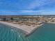 Aerial of beachfront property and waterway access at 7466 Bayshore Dr # 406, Treasure Island, FL 33706