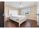 Charming bedroom with white furniture and hardwood floors at 7466 Bayshore Dr # 406, Treasure Island, FL 33706