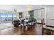 Living room with hardwood floors and access to balcony with ocean view at 7466 Bayshore Dr # 406, Treasure Island, FL 33706