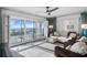 Living room features sliding doors to balcony with ocean view at 7466 Bayshore Dr # 406, Treasure Island, FL 33706