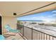 Relaxing balcony with ocean views and patio furniture at 7466 Bayshore Dr # 406, Treasure Island, FL 33706