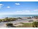 Scenic beach and ocean view from a balcony at 7466 Bayshore Dr # 406, Treasure Island, FL 33706