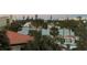 Scenic waterfront view with lush tropical landscaping and charming homes at 7466 Bayshore Dr # 406, Treasure Island, FL 33706