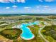 Aerial view of community and Crystal Lagoon water park at 7853 Roma Dune Dr, Wesley Chapel, FL 33545