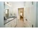 Bathroom with a vanity, sink and view into another room at 7853 Roma Dune Dr, Wesley Chapel, FL 33545