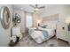 Bright bedroom with a queen bed and stylish decor at 7853 Roma Dune Dr, Wesley Chapel, FL 33545