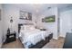 Cozy bedroom with a queen-size bed and built-in storage at 7853 Roma Dune Dr, Wesley Chapel, FL 33545