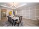 Bright dining room featuring a large table and wall art at 7853 Roma Dune Dr, Wesley Chapel, FL 33545