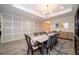 Spacious dining area with a wood table and neutral color palette at 7853 Roma Dune Dr, Wesley Chapel, FL 33545