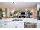 Kitchen island with double sink, overlooking the living room at 7853 Roma Dune Dr, Wesley Chapel, FL 33545