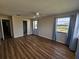 Spacious bedroom with wood-look flooring and large windows at 7975 58Th N Ave # 402, St Petersburg, FL 33709