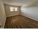 Bedroom with hardwood floors and large window at 7975 58Th N Ave # 402, St Petersburg, FL 33709