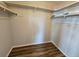 Walk-in closet with double hanging rods and shelving at 7975 58Th N Ave # 402, St Petersburg, FL 33709