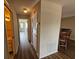 Hallway with wood-look floors and access to rooms at 7975 58Th N Ave # 402, St Petersburg, FL 33709