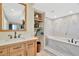 Elegant bathroom featuring a soaking tub and marble tile at 813 Bahia Del Sol Dr # 33, Ruskin, FL 33570