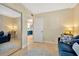 Bright bedroom with mirrored closet and blue couch at 813 Bahia Del Sol Dr # 33, Ruskin, FL 33570