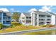 Waterfront condo building with private balconies and landscaping at 813 Bahia Del Sol Dr # 33, Ruskin, FL 33570